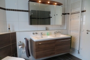 Apartment 2: Double sink with cupboard in bathroom